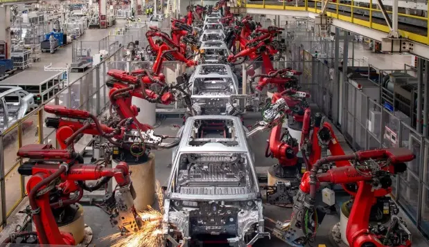 Robots on an automotive body assembly line